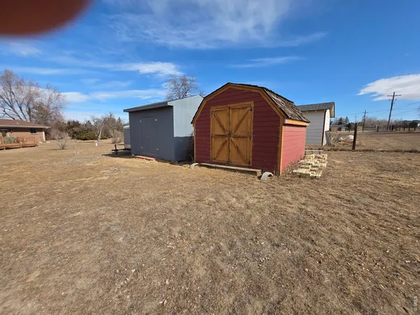 a view of a backyard of the house