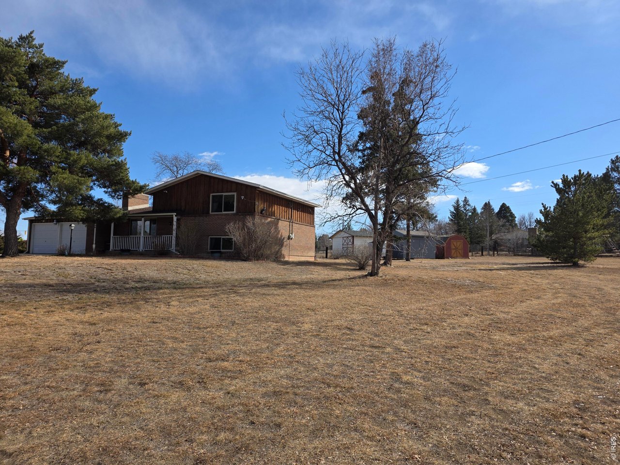 8840 Niwot Road Niwot, CO 80503 - Photo 31 of 34 a front view of a house with a yard