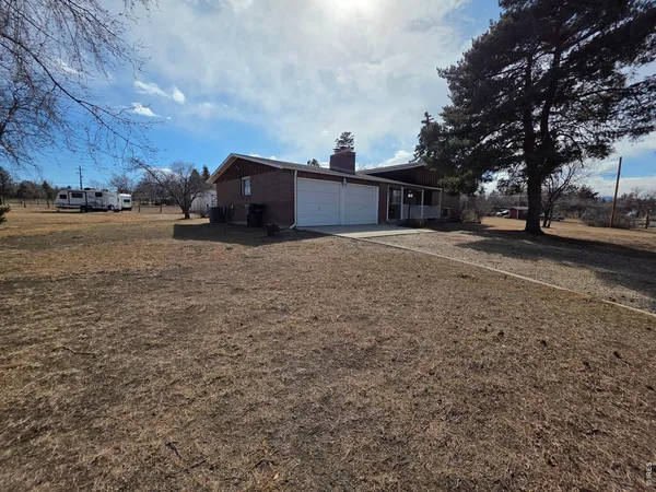 a view of a house with a yard