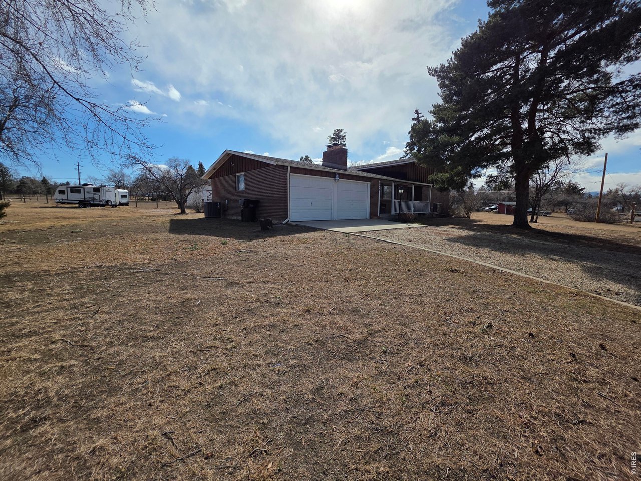 8840 Niwot Road Niwot, CO 80503 - Photo 32 of 34 a view of a house with a yard