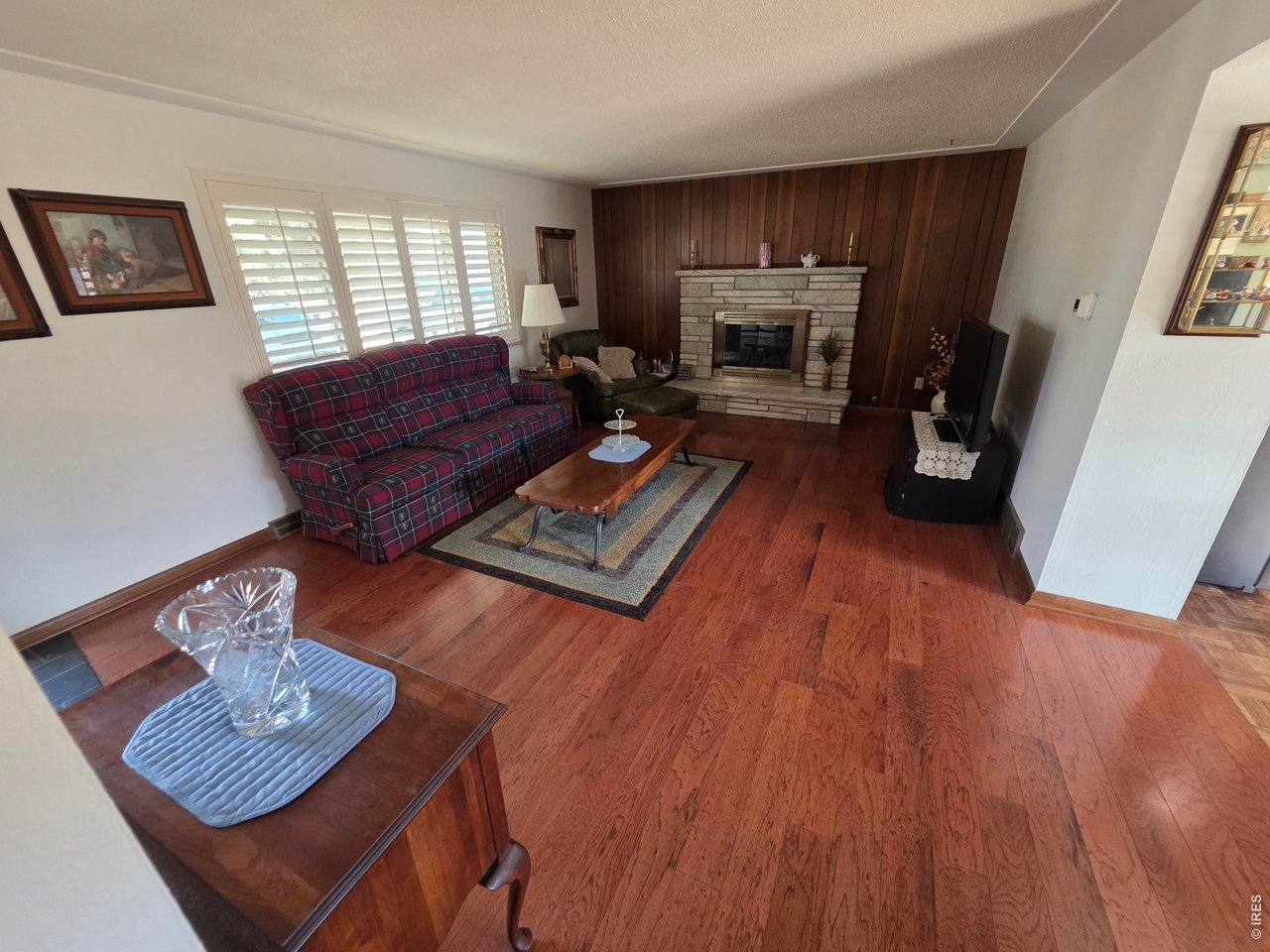 8840 Niwot Road Niwot, CO 80503 - Photo 5 of 34 a living room with furniture and a fireplace