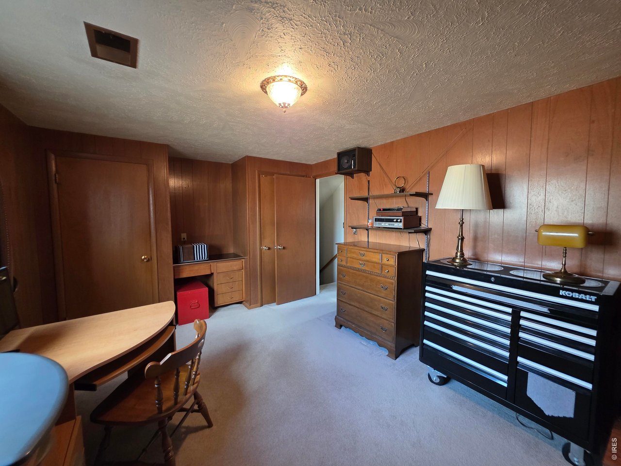 8840 Niwot Road Niwot, CO 80503 - Photo 10 of 34 a kitchen with a table chairs refrigerator and microwave