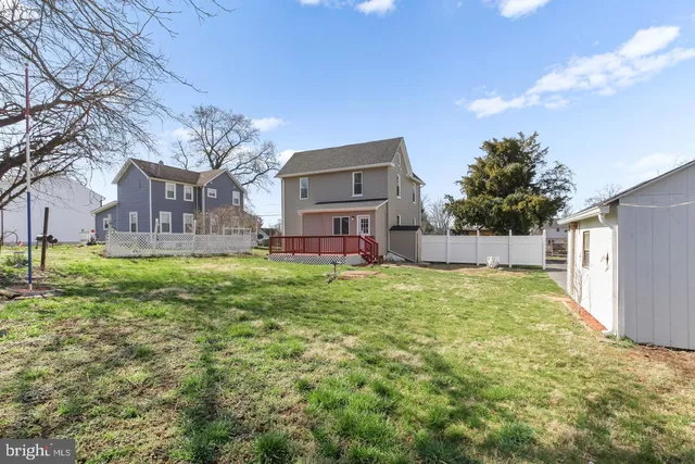 a view of a chairs in backyard of house