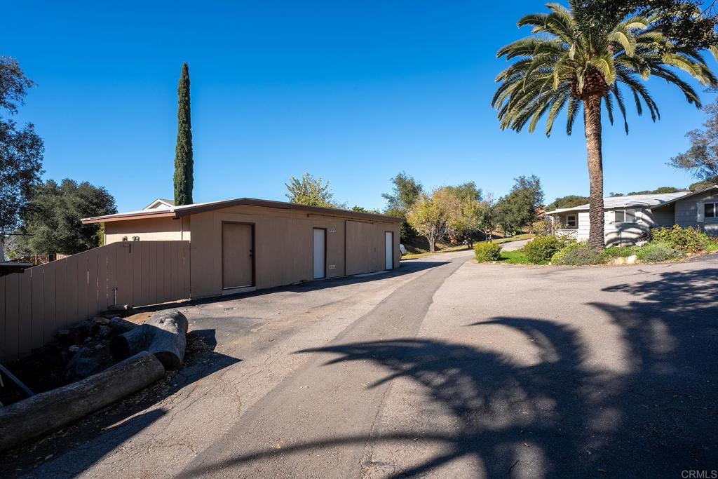 2560-66 Alpine Boulevard Alpine, CA 91901 - Photo 11 of 32 a view of a house with backyard and trees