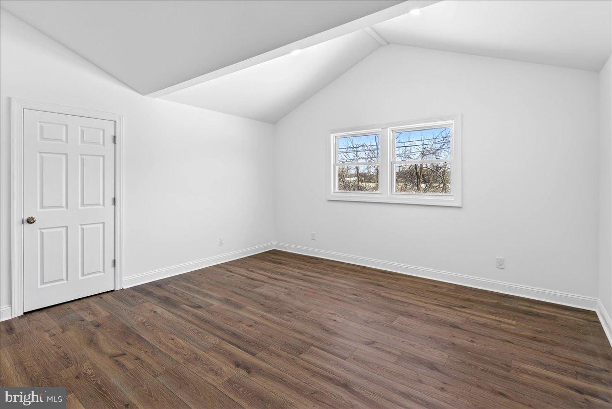 464 Sykesville Road Wrightstown, NJ 08562 - Photo 16 of 32 an empty room with wooden floor and windows
