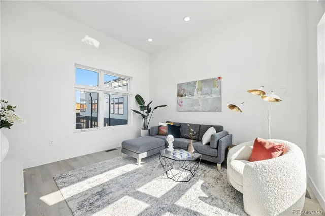 a living room with furniture and a rug