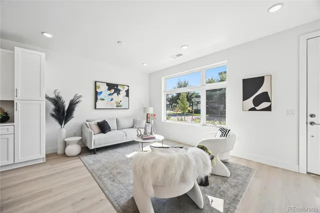 a spacious bedroom with a large bed and a couch