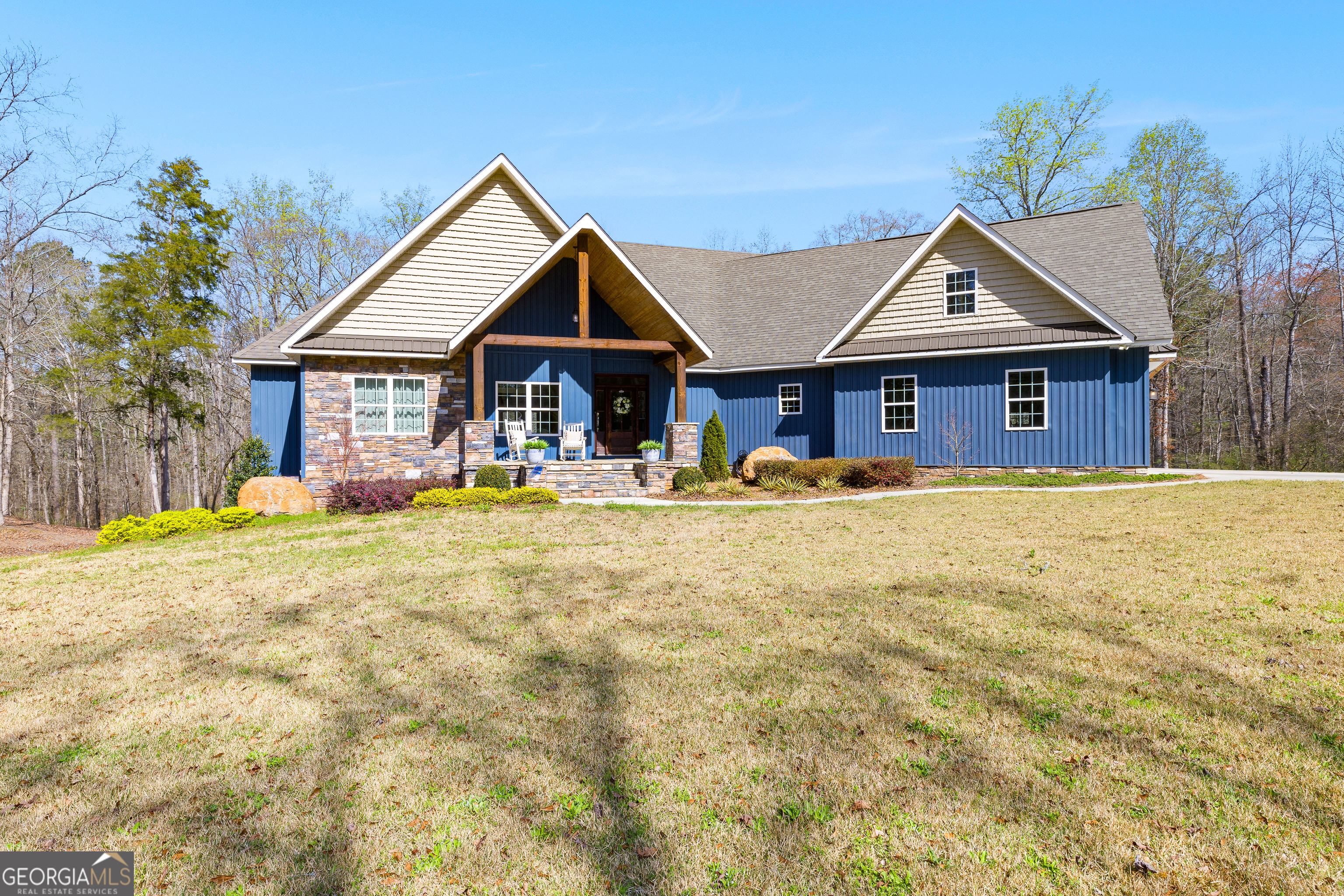 276 Davis Lake Road Thomaston, GA 30286 - Photo 3 of 108 a front view of house with yard and trees in the background