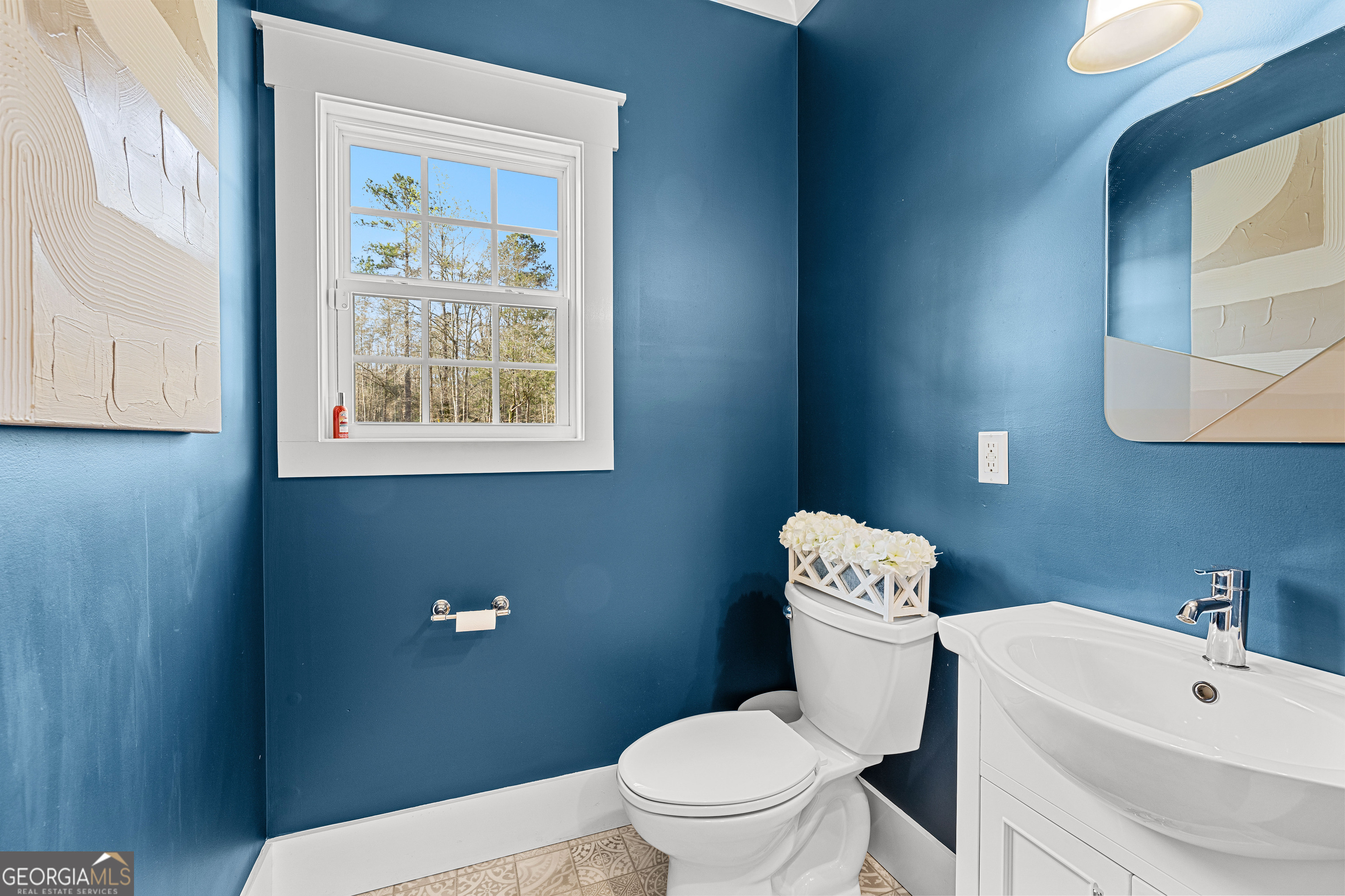 276 Davis Lake Road Thomaston, GA 30286 - Photo 38 of 108 a white toilet sitting next to a bathroom sink
