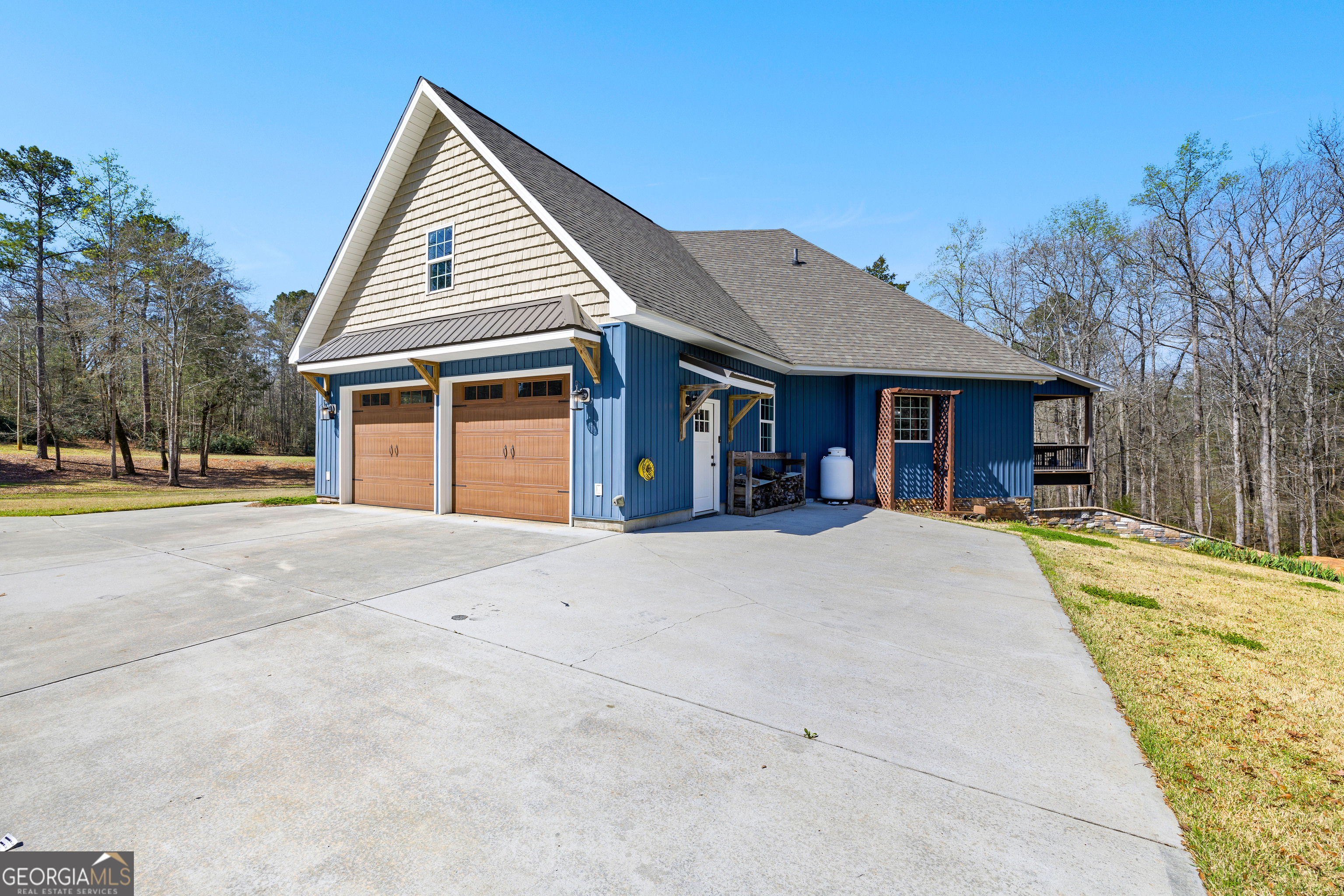 276 Davis Lake Road Thomaston, GA 30286 - Photo 5 of 108 a front view of a house with a yard and garage
