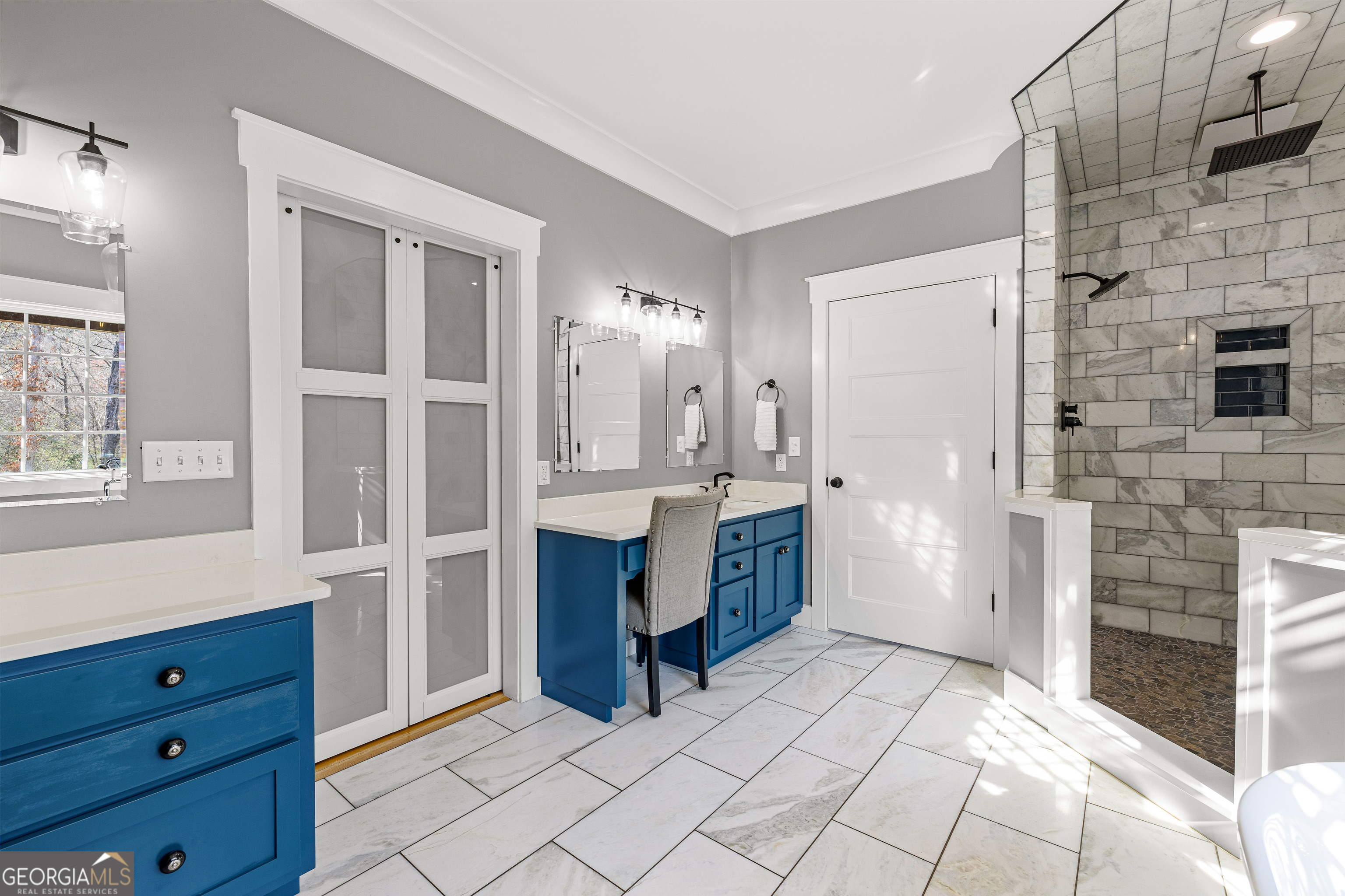 276 Davis Lake Road Thomaston, GA 30286 - Photo 52 of 108 a bathroom with a sink a mirror and a shower