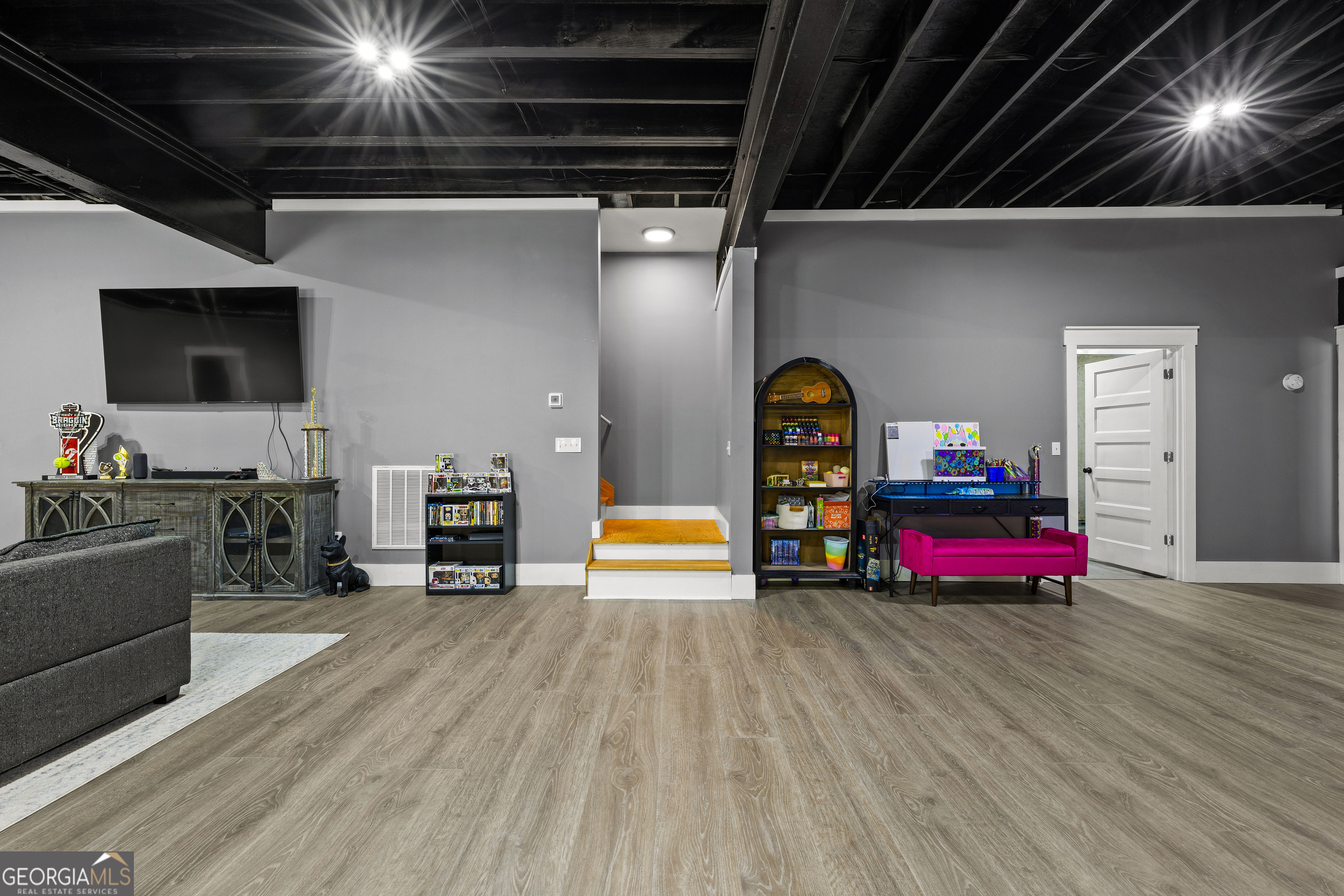 276 Davis Lake Road Thomaston, GA 30286 - Photo 64 of 108 a living room with furniture and a flat screen tv