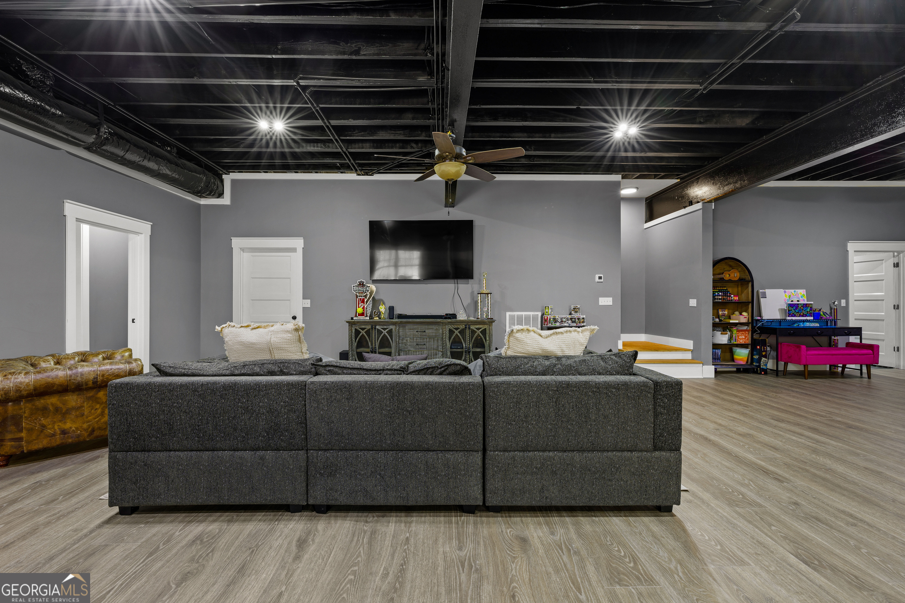 276 Davis Lake Road Thomaston, GA 30286 - Photo 66 of 108 a living room with furniture and a flat screen tv