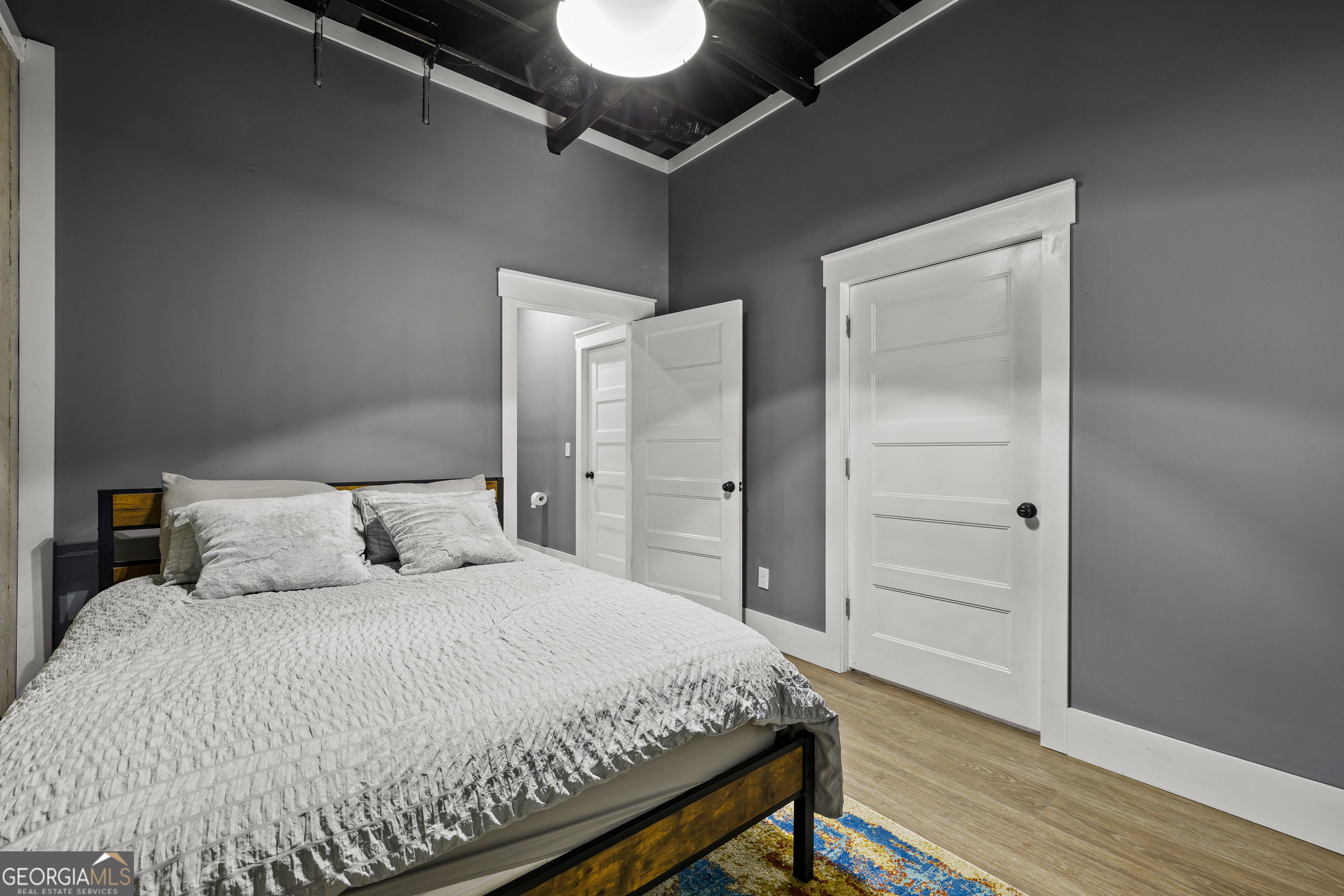276 Davis Lake Road Thomaston, GA 30286 - Photo 68 of 108 a bedroom with a bed and wooden floor