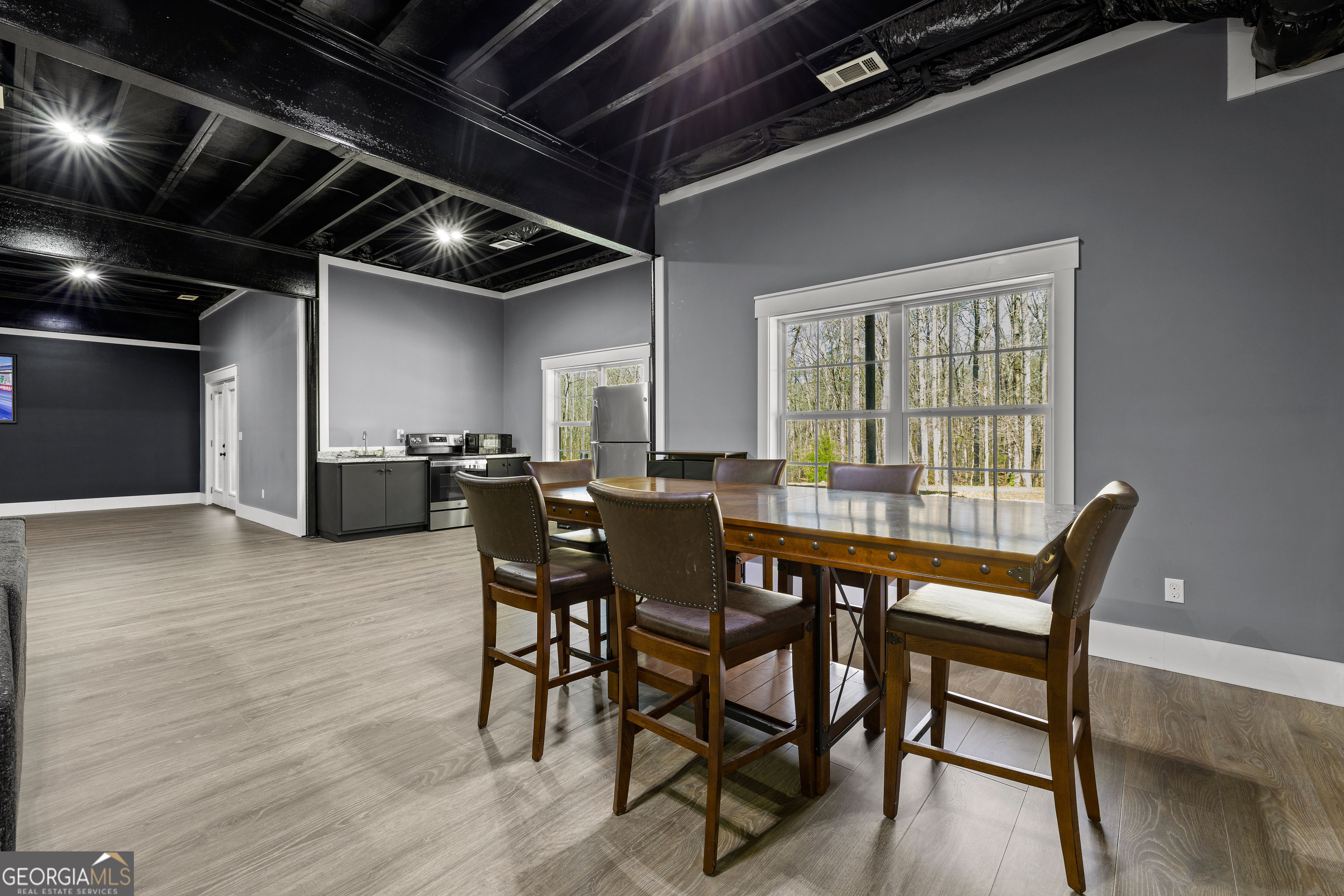 276 Davis Lake Road Thomaston, GA 30286 - Photo 75 of 108 a view of a dining room with furniture window and wooden floor
