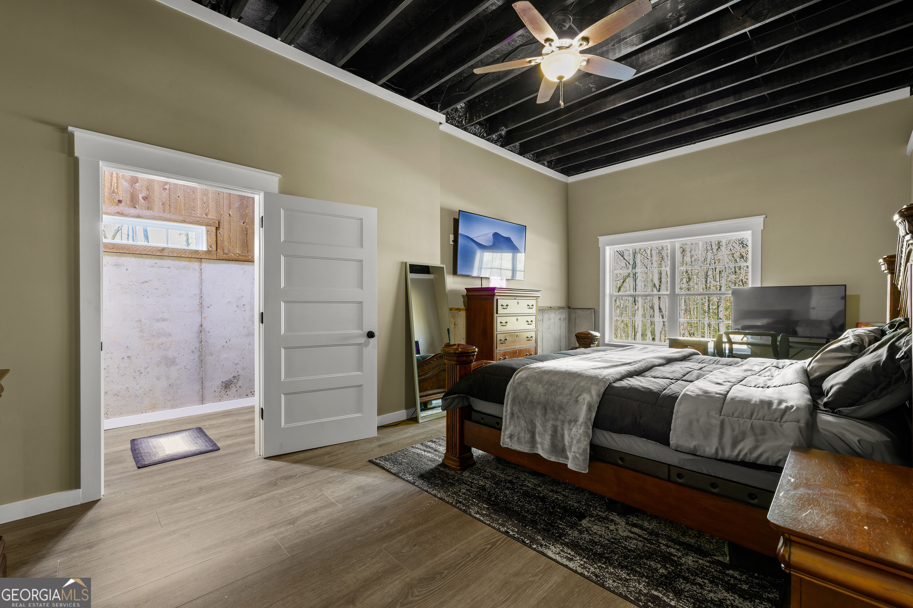 276 Davis Lake Road Thomaston, GA 30286 - Photo 82 of 108 a bedroom with a bed and a walk in closet