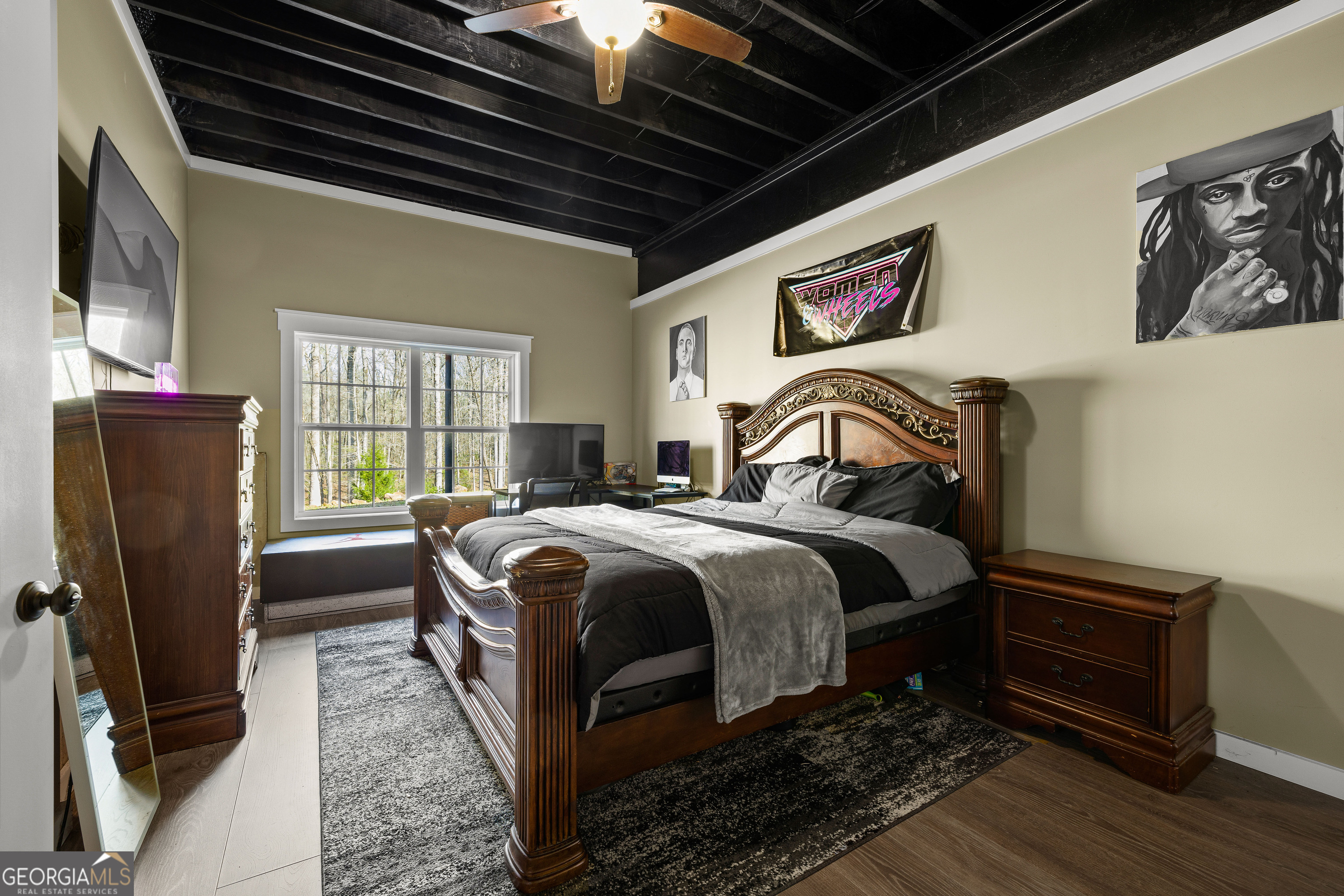 276 Davis Lake Road Thomaston, GA 30286 - Photo 83 of 108 a bedroom with a bed next to a window with wooden floor