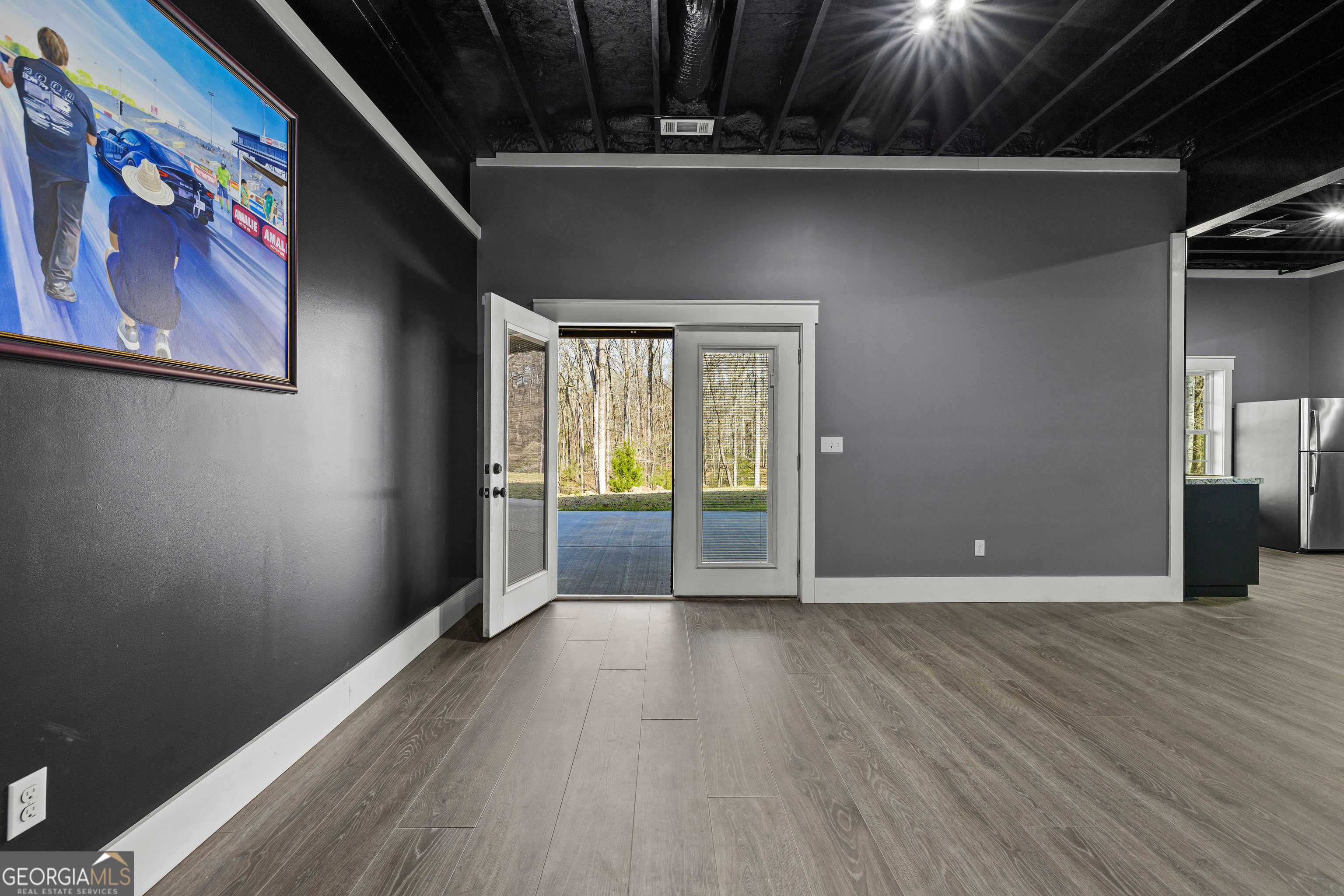 276 Davis Lake Road Thomaston, GA 30286 - Photo 85 of 108 a view of an empty room with wooden floor