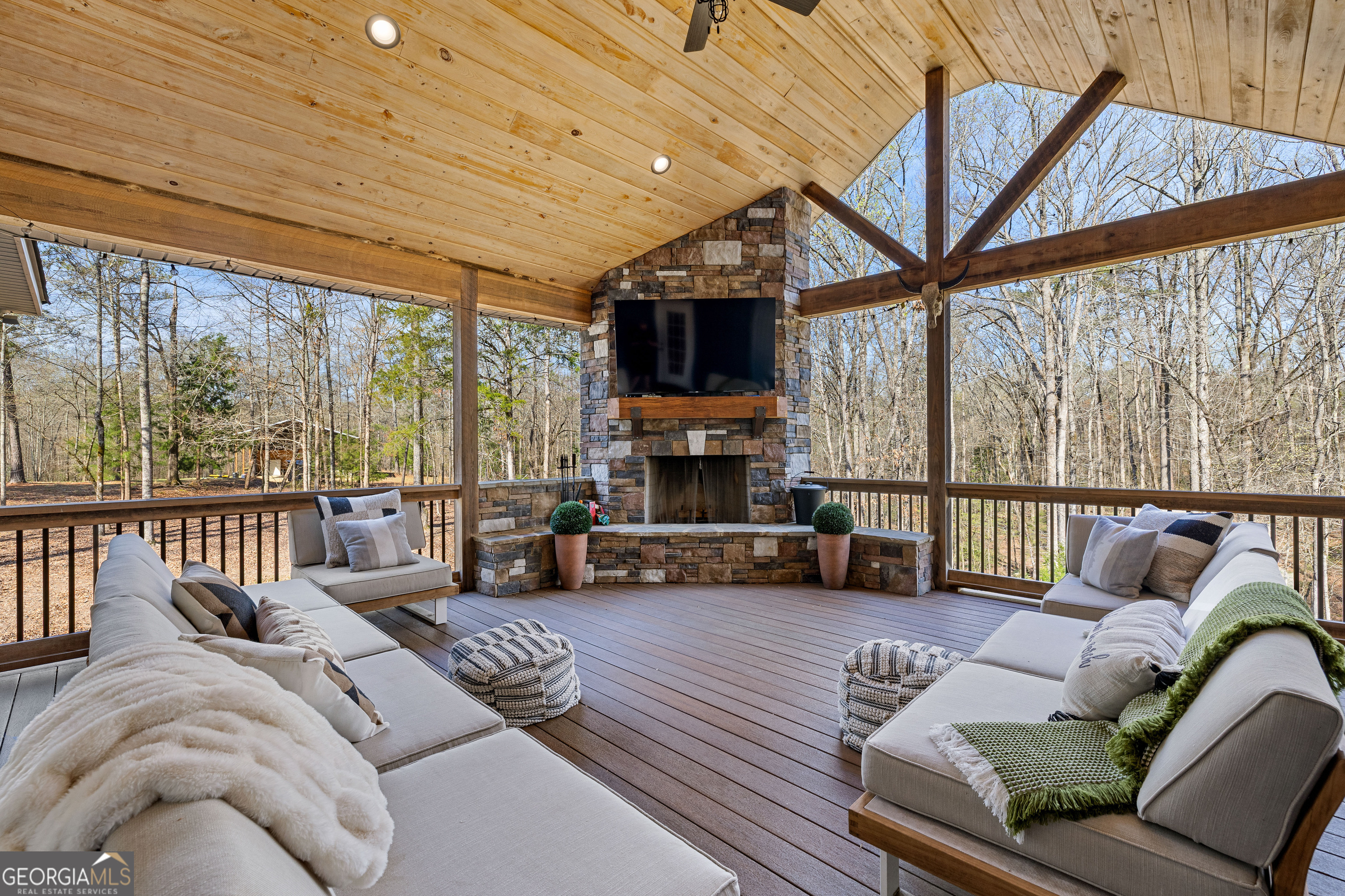 276 Davis Lake Road Thomaston, GA 30286 - Photo 88 of 108 a bedroom with furniture a flat screen tv and a large window