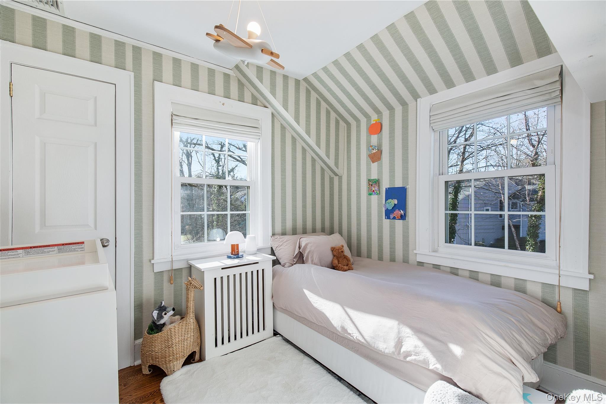 25 Roxbury Road Scarsdale, NY 10583 - Photo 23 of 32 Bedroom #4- Another sunny bedroom with two exposure views and a closet completes the second floor.
