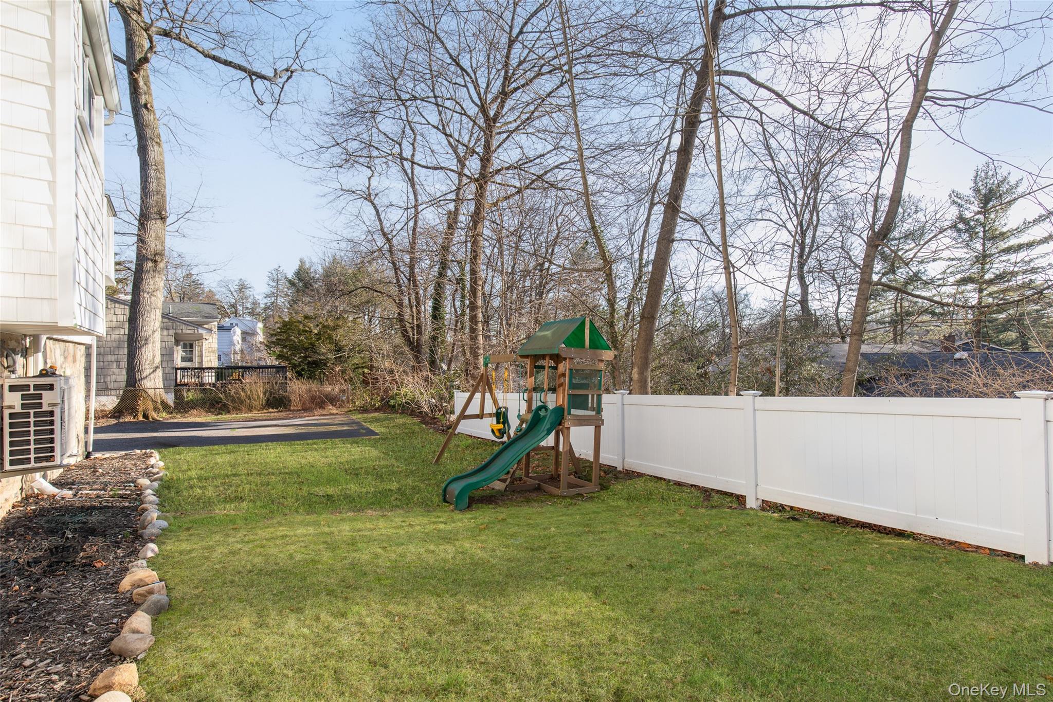 25 Roxbury Road Scarsdale, NY 10583 - Photo 26 of 32 Additional view of the level backyard and picturesque setting.