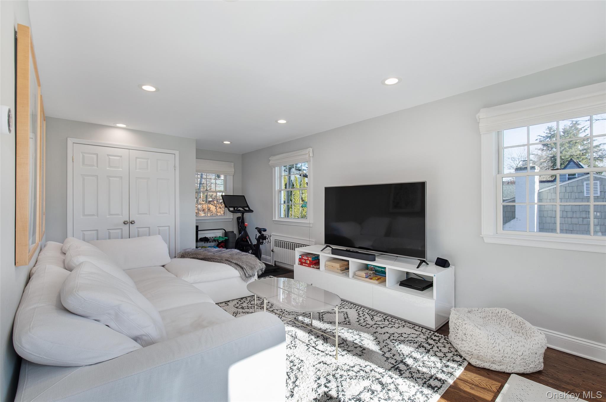 25 Roxbury Road Scarsdale, NY 10583 - Photo 7 of 32 View of the airy and bright family room with large windows, three exposure views and a closet.