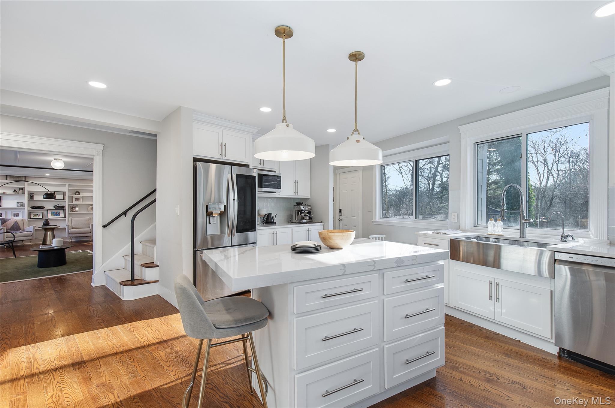 25 Roxbury Road Scarsdale, NY 10583 - Photo 10 of 32 View of the seamless open layout highlights the spacious and modern open kitchen.