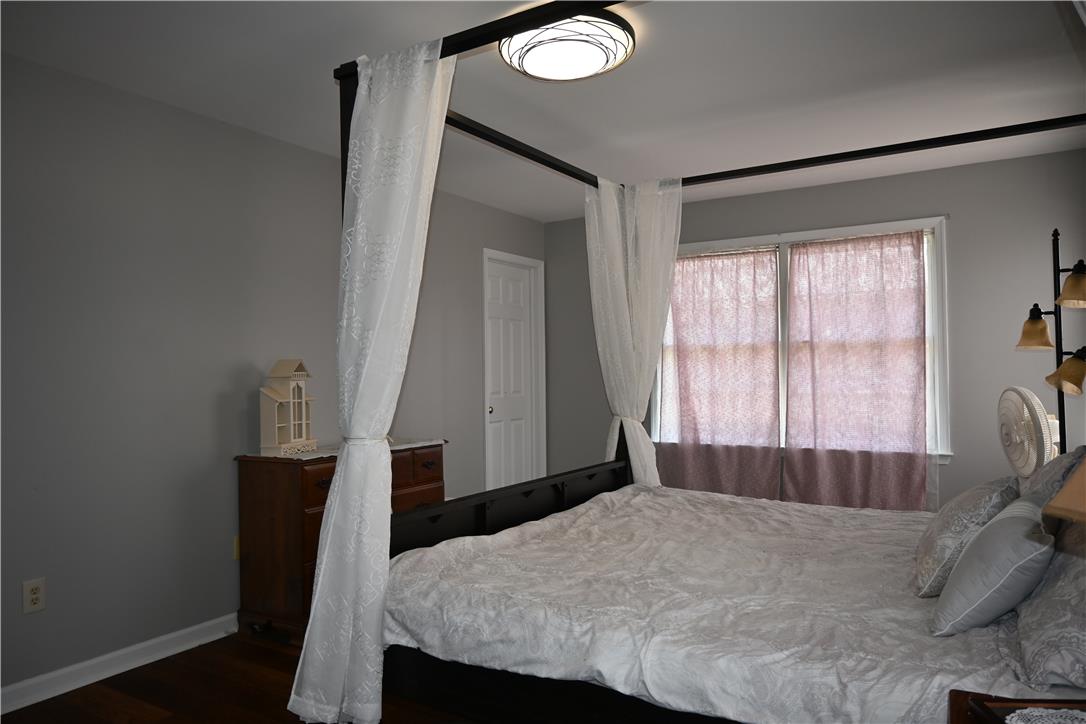 3829 East Hopewell Road Center Valley, PA 18034 - Photo 29 of 52 Hardwood floors and a large window define this bedroom's elegant yet comfortable ambiance.