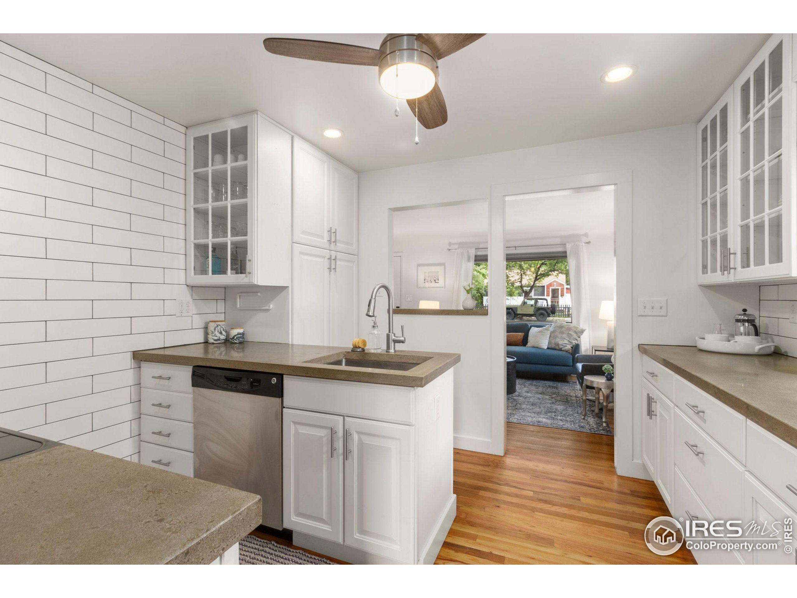 217 Park Street Fort Collins, CO 80521 - Photo 12 of 29 a kitchen with a sink cabinets and wooden floor