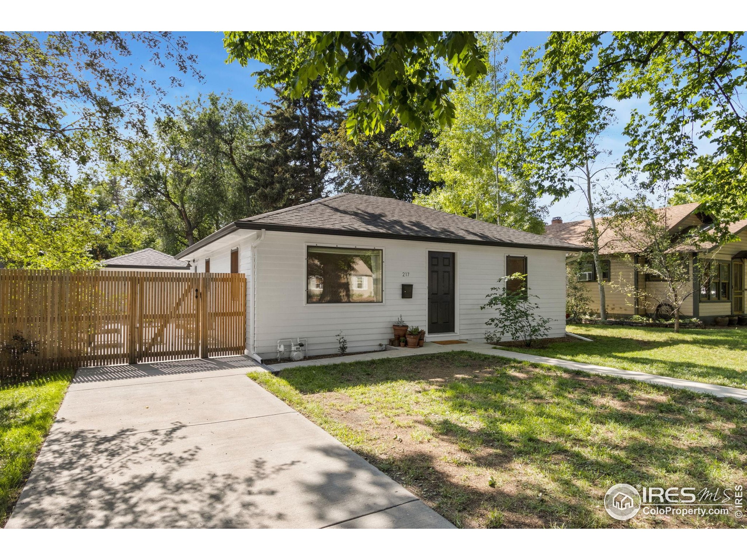 217 Park Street Fort Collins, CO 80521 - Photo 2 of 29 a view of a house with a yard and sitting area