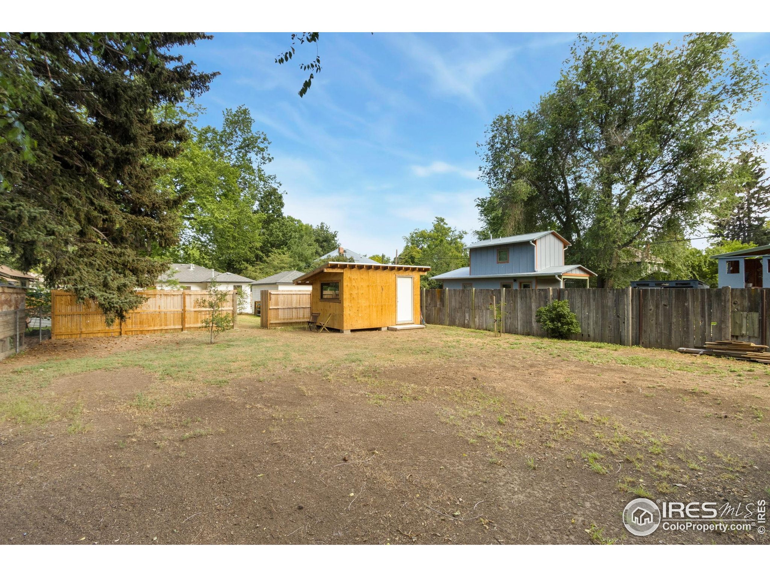 217 Park Street Fort Collins, CO 80521 - Photo 27 of 29 a view of a house with a yard and tree