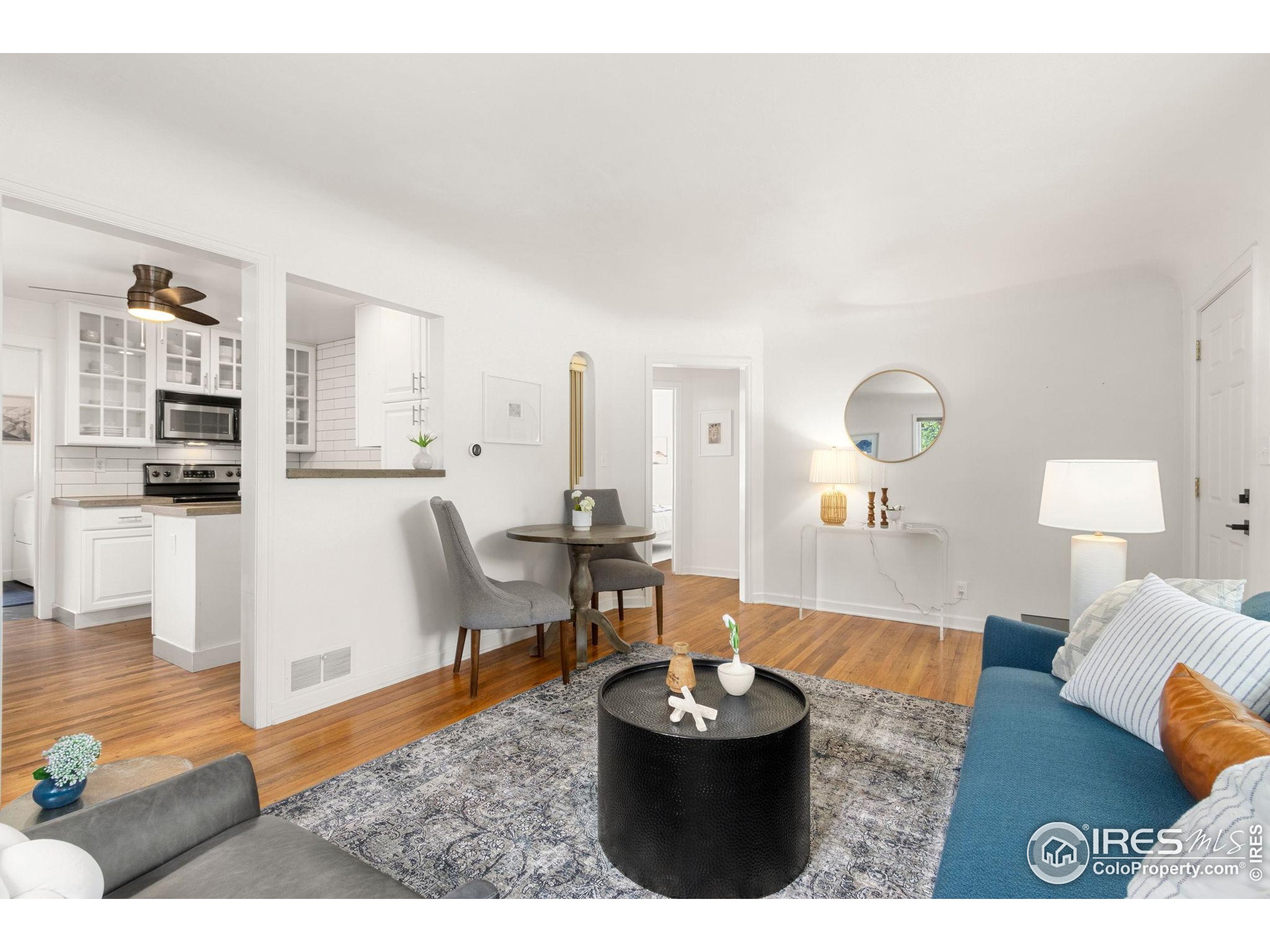 217 Park Street Fort Collins, CO 80521 - Photo 7 of 29 a living room with furniture and a wooden floor