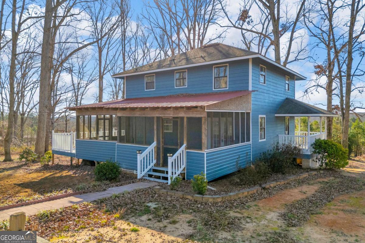 2975 Highway 72 Comer, GA 30629 - Photo 2 of 42 a front view of a house with garden