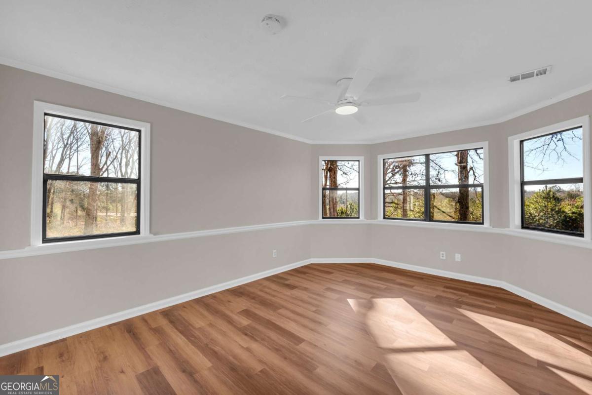 2975 Highway 72 Comer, GA 30629 - Photo 25 of 42 a view of an empty room with wooden floor and a window