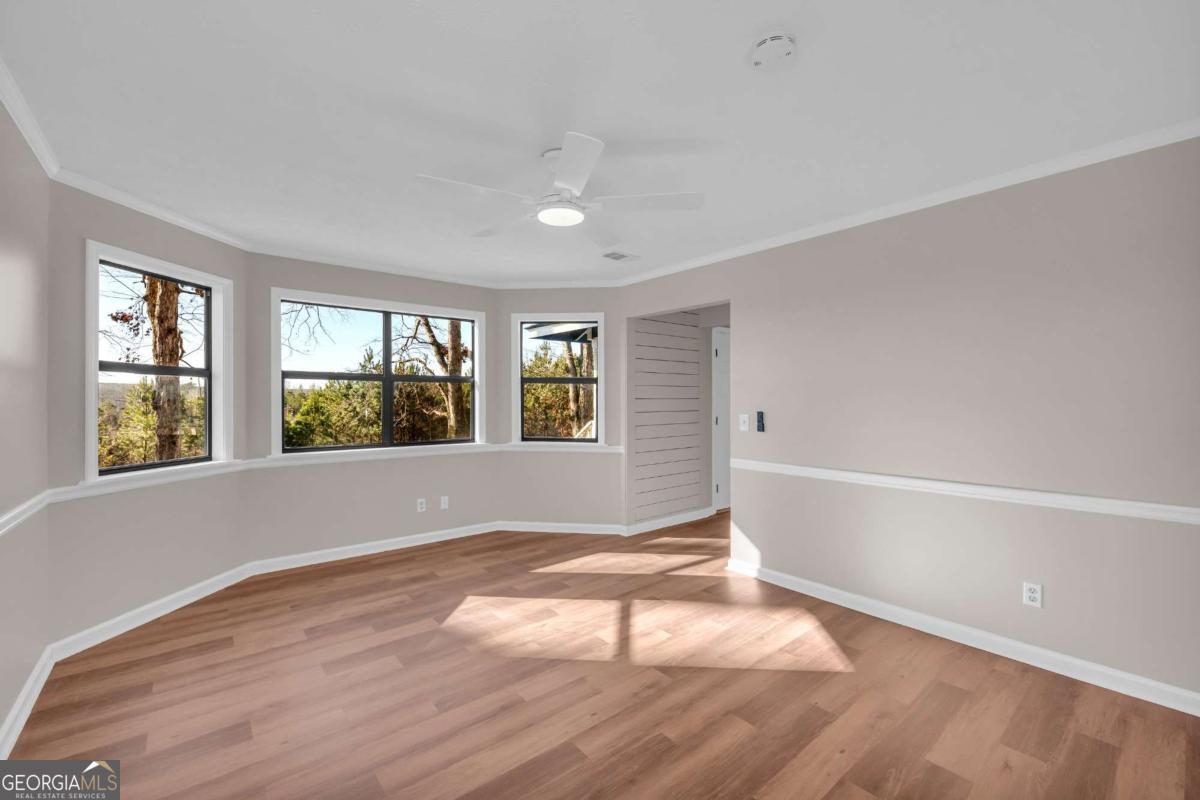 2975 Highway 72 Comer, GA 30629 - Photo 28 of 42 a view of an empty room with wooden floor and a window