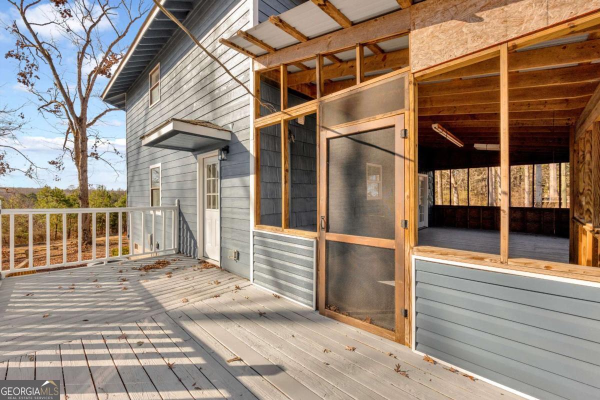 2975 Highway 72 Comer, GA 30629 - Photo 38 of 42 a view of a balcony with wooden floor and fence