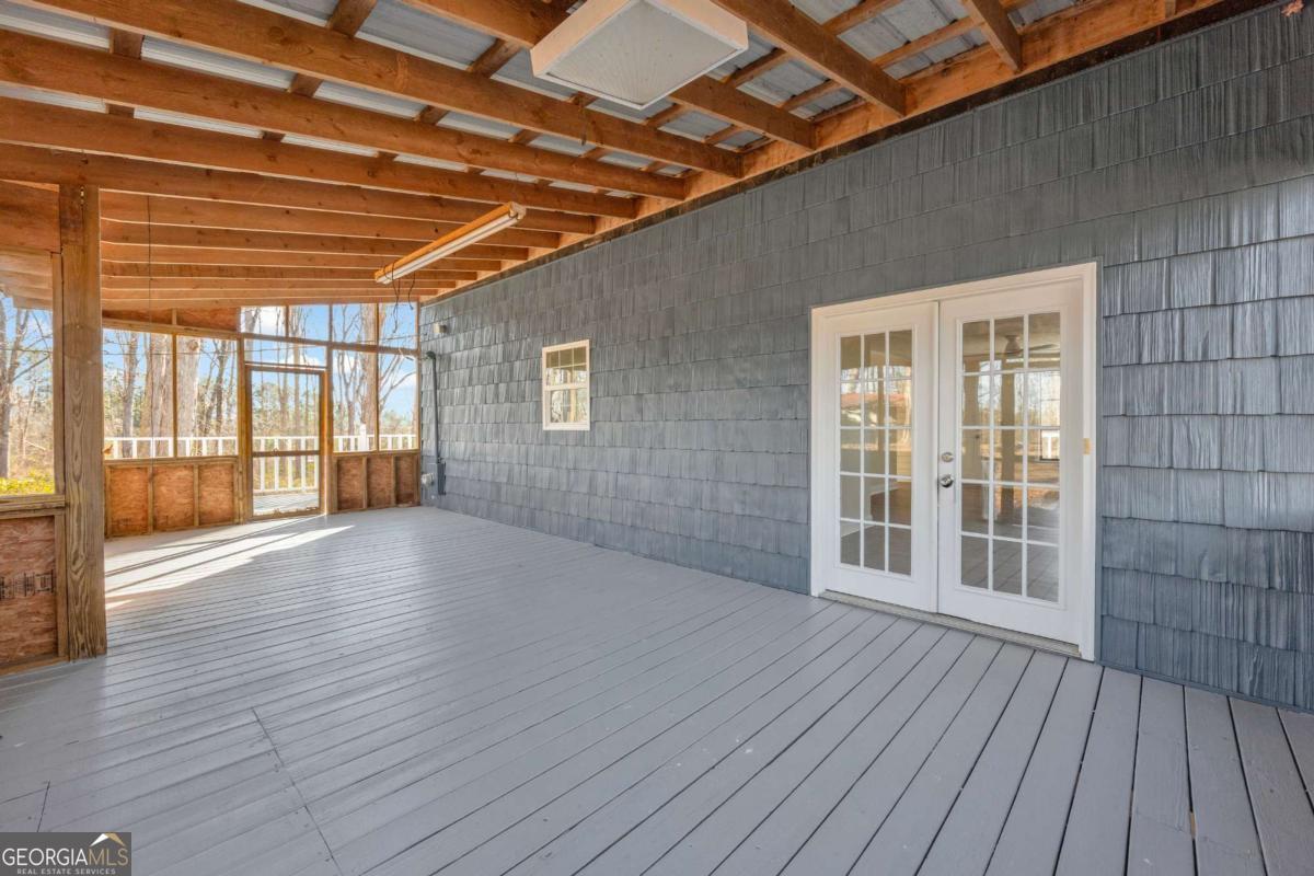 2975 Highway 72 Comer, GA 30629 - Photo 7 of 42 an empty room with wooden floor and windows