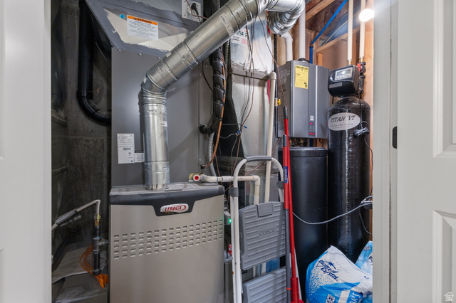 882 Sego Lily Way Mapleton, UT 84664 - Photo 30 of 41 Utility closet featuring a Lennox furnace, ductwork, and water treatment system