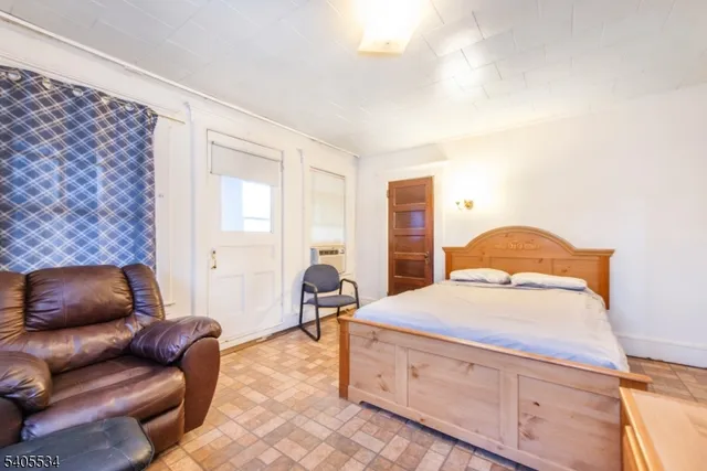 a bedroom with furniture and a couch