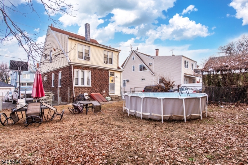 448 East 31st Street Paterson, NJ 07504 - Photo 22 of 23 a view of a house with backyard and sitting area