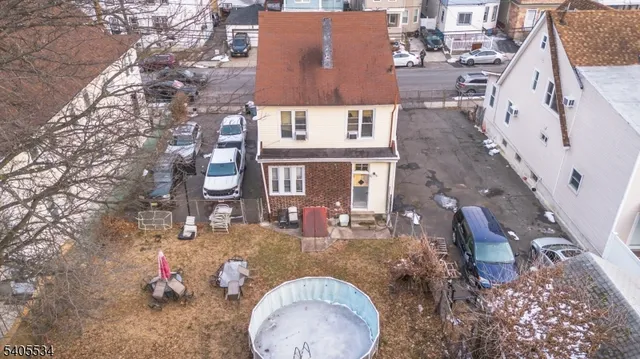 an aerial view of a house with outdoor space