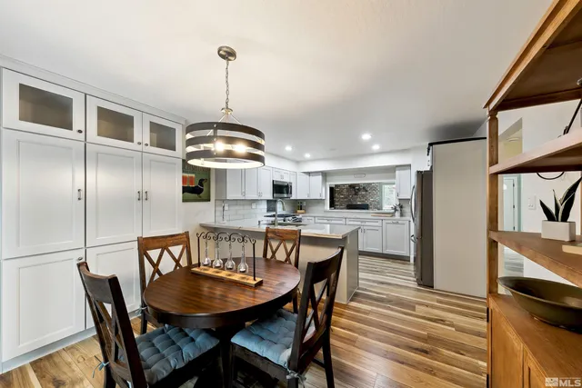 a view of a dining room with furniture window and wooden floor