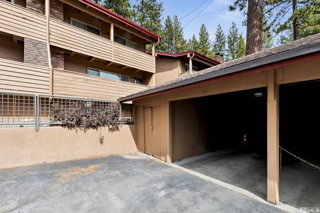 a view of a house with a snow in the background