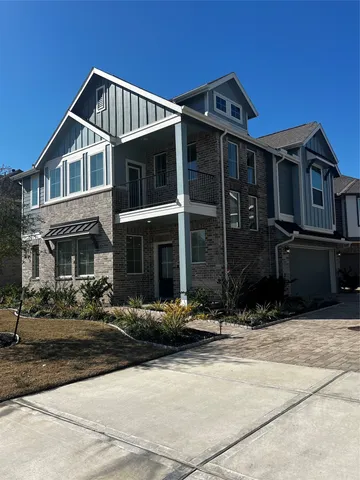 a front view of a house with yard