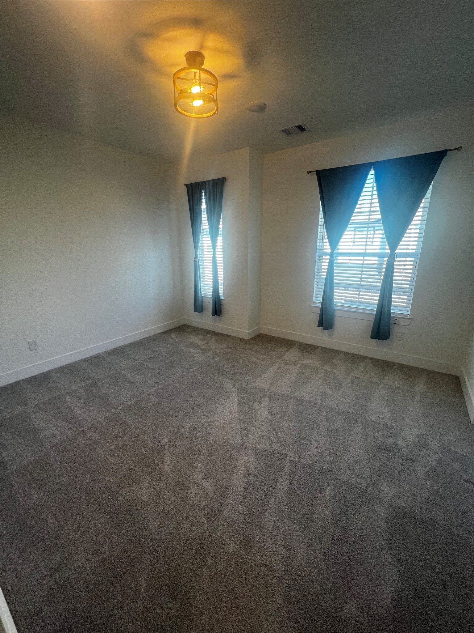 7743 Swooping Swallow Lane Katy, TX 77493 - Photo 33 of 45 an empty room with a empty space and windows