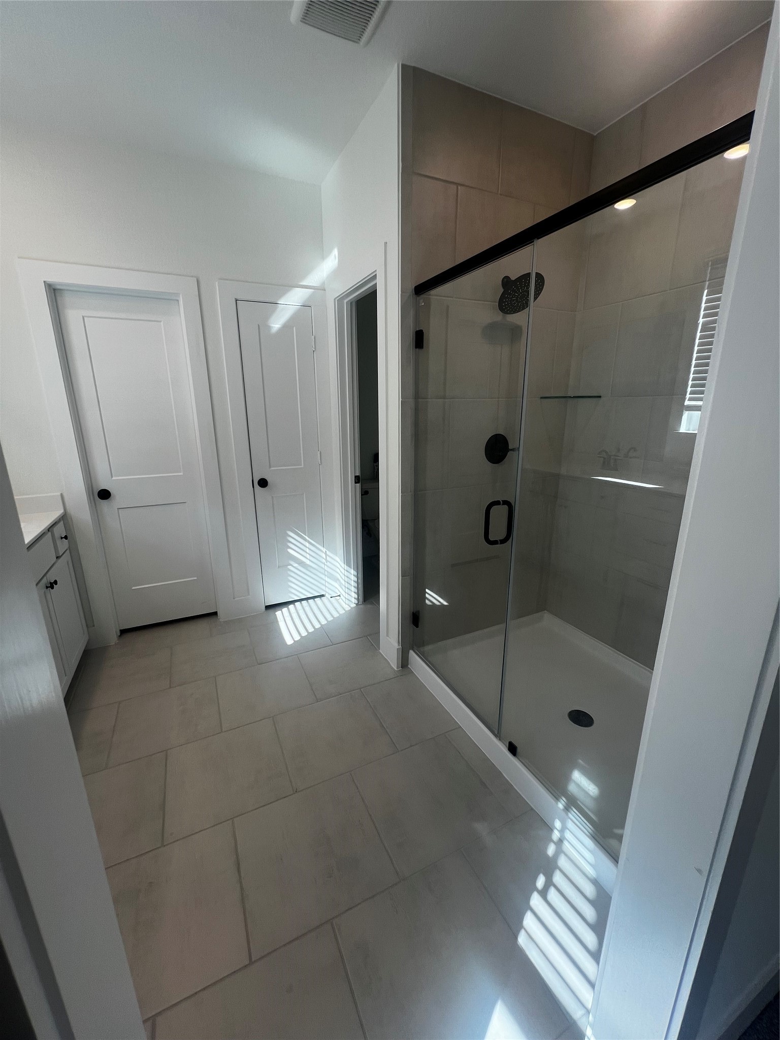 7743 Swooping Swallow Lane Katy, TX 77493 - Photo 35 of 45 a bathroom with a shower and a sink