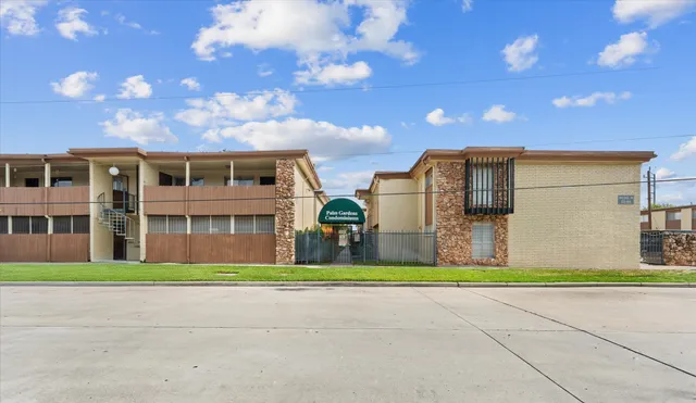 a front view of building with yard and green space