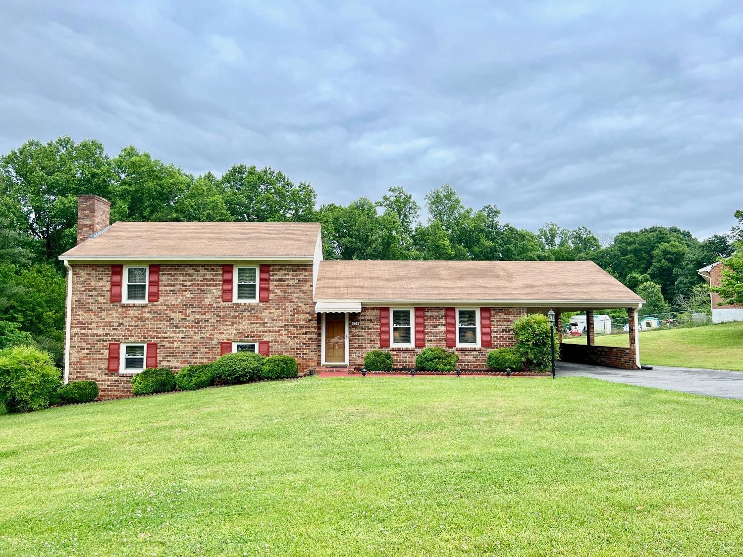 104 River Ridge Road Madison Heights, VA 24572 - Photo 1 of 35 a front view of a house with garden