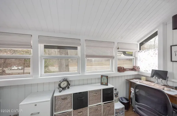 a view of a kitchen with a sink and windows
