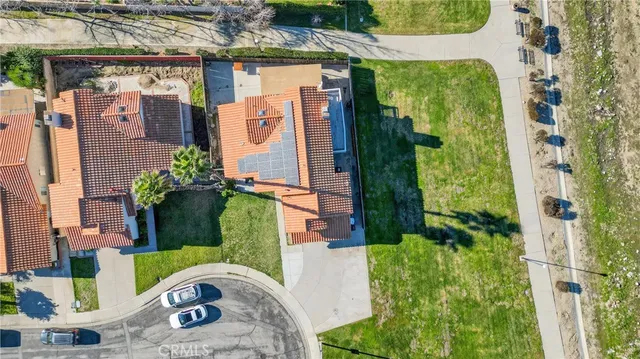 an aerial view of a house with a garden
